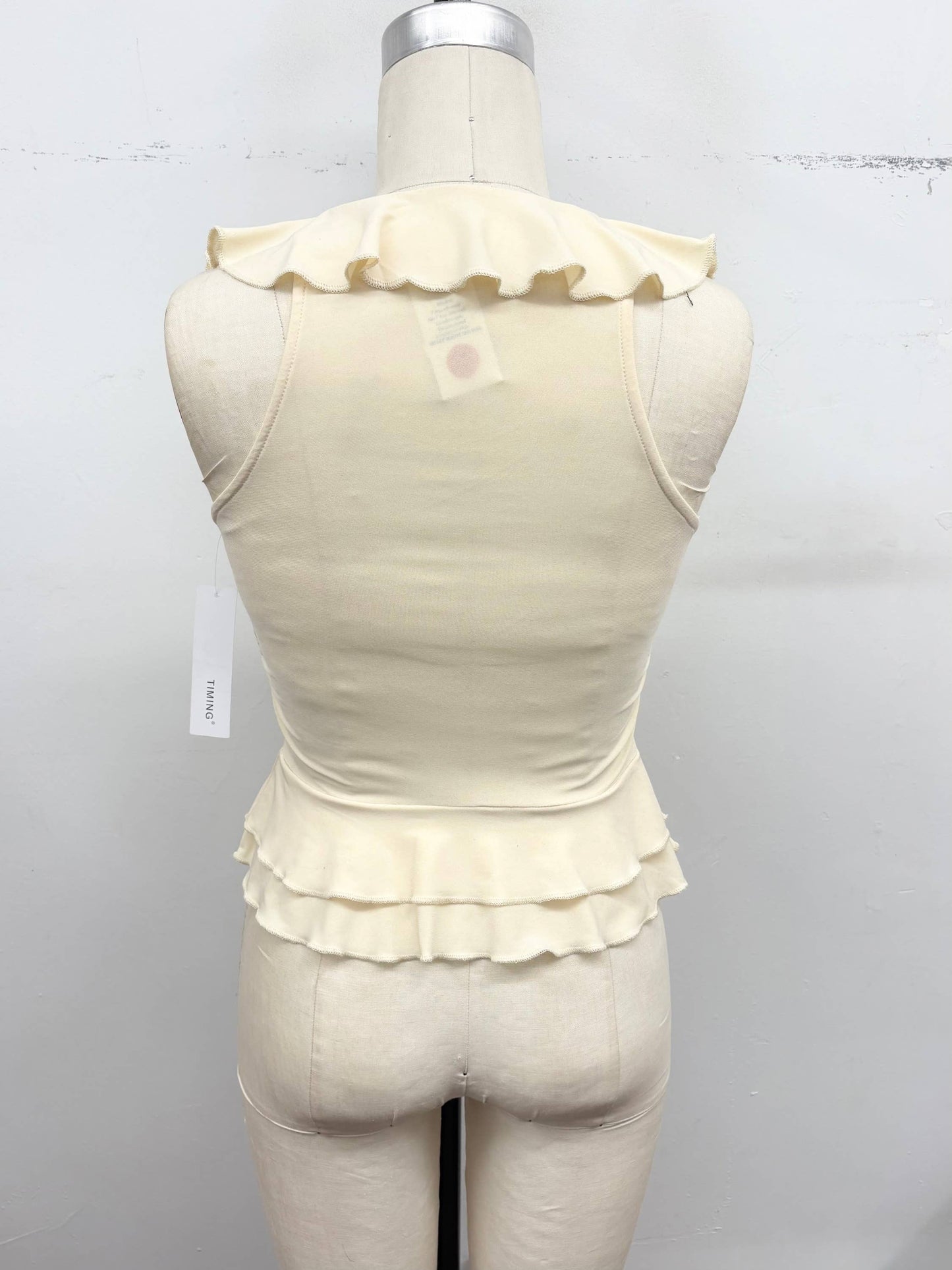 Ruffle Trim Sleeveless Peplum Top | B043