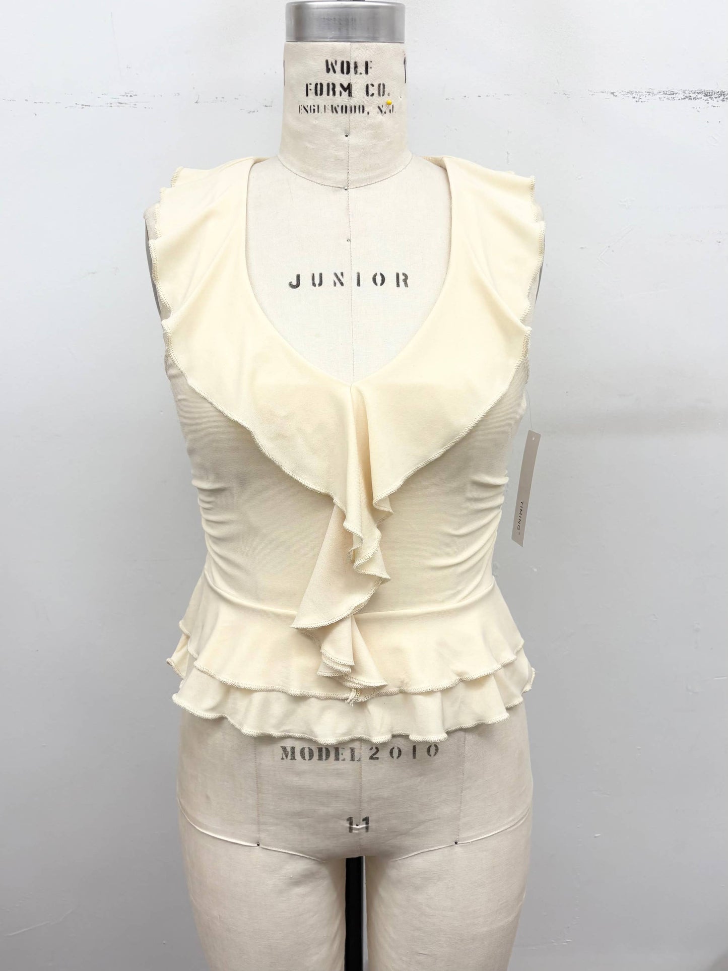 Ruffle Trim Sleeveless Peplum Top | B043